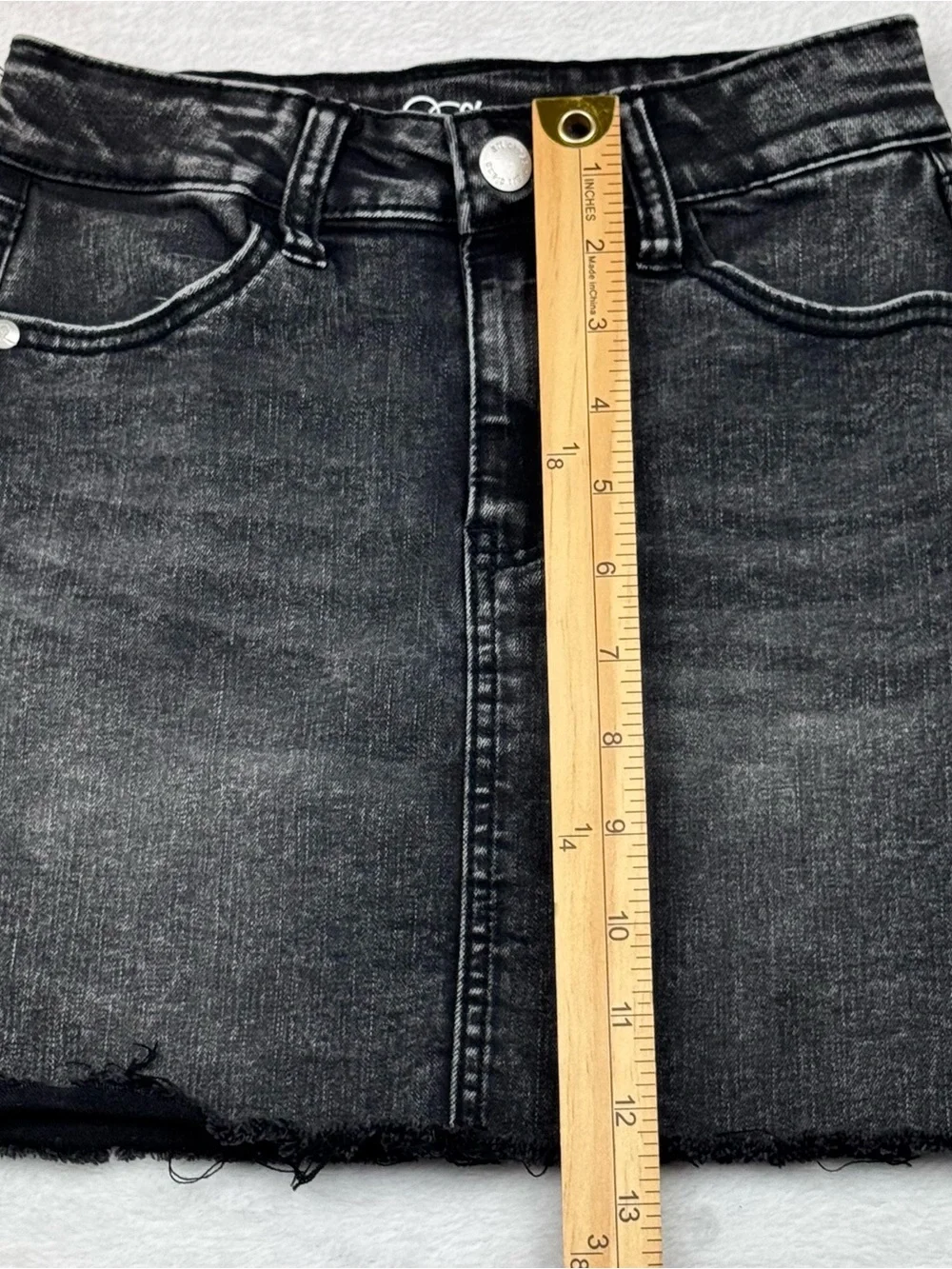 Lot of 2 girls denim skirts. The blue shirt is a size 8, black skirt is size 7/8